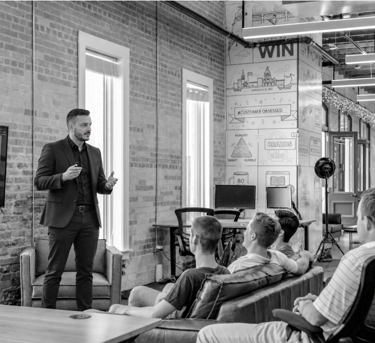 Moonwalk founder presenting to a small group in an office
